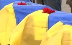 В Запорожье и Днепропетровске хоронят десятки неопознанных бойцов АТО