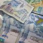 Курс тенге укрепился к швейцарскому франку, но снизился к канадскому доллару